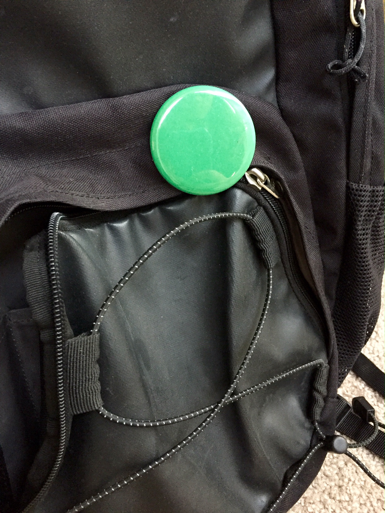 I still carry my green dot with me on my backpack.